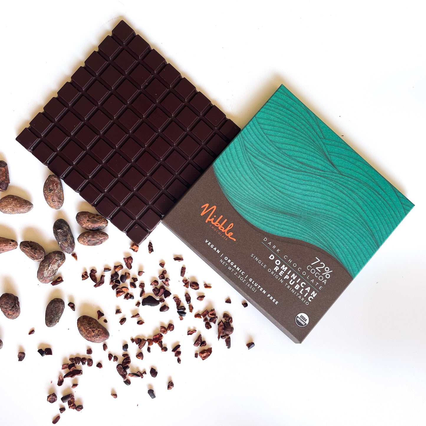 Nibble Chocolate 72% cocoa bar from Dominican Republic with cacao beans and nibs.