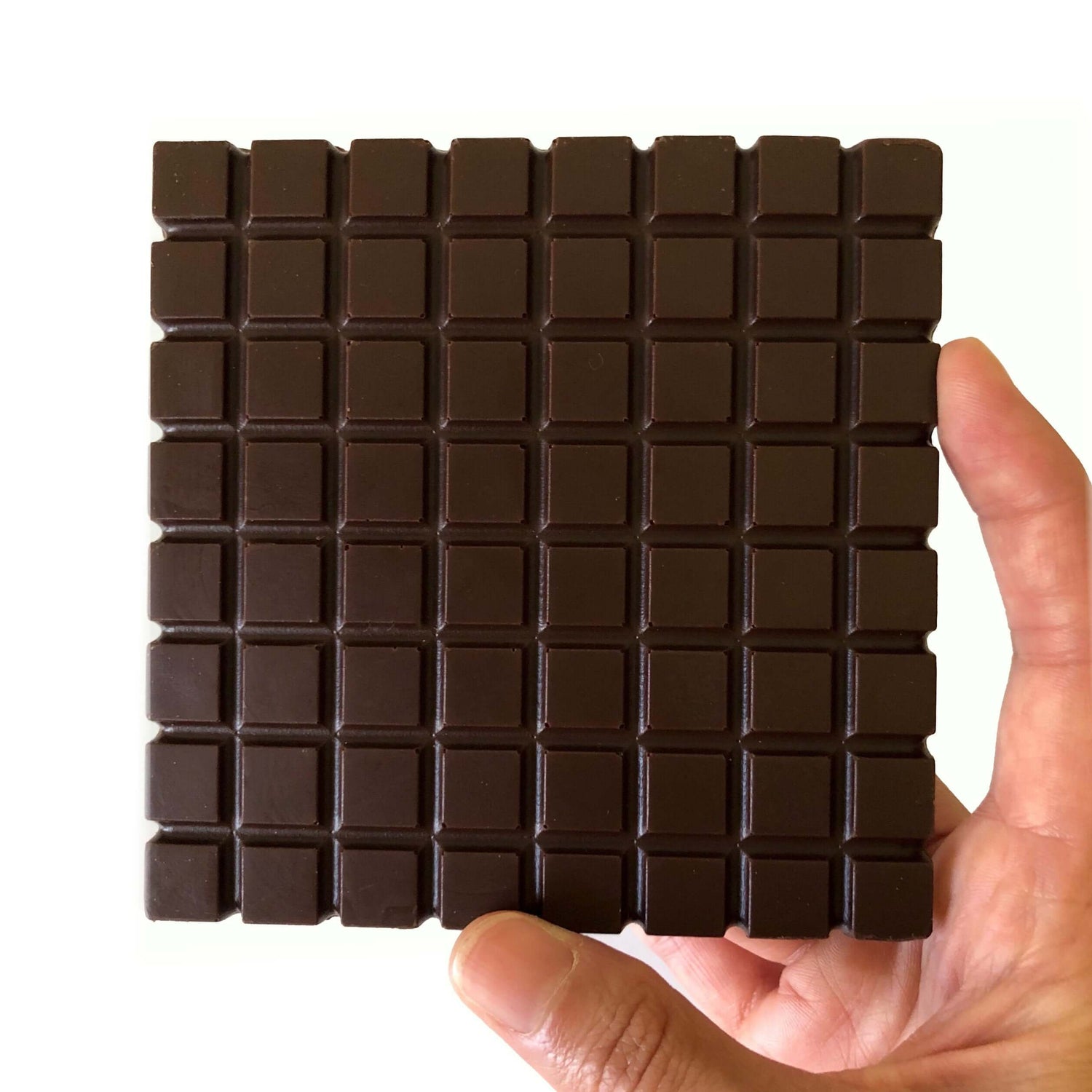 Hand holding Margarita dark chocolate bar infused with tequila and elderflower liquor