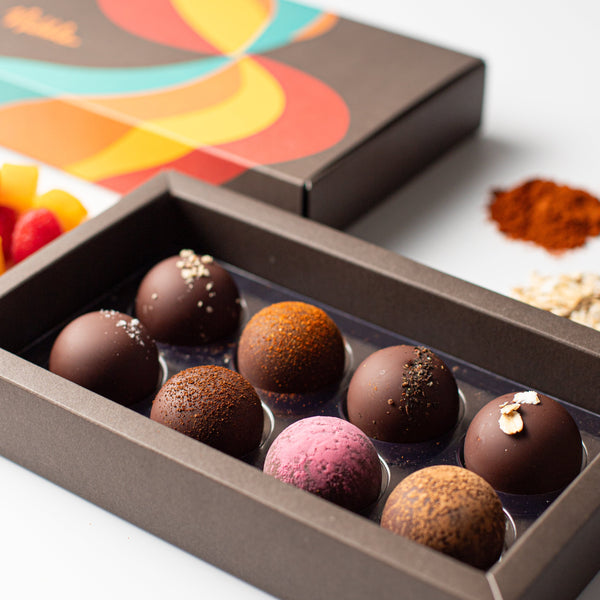 Close-up of assorted vegan organic chocolate truffles in gift box – Nibble Chocolate