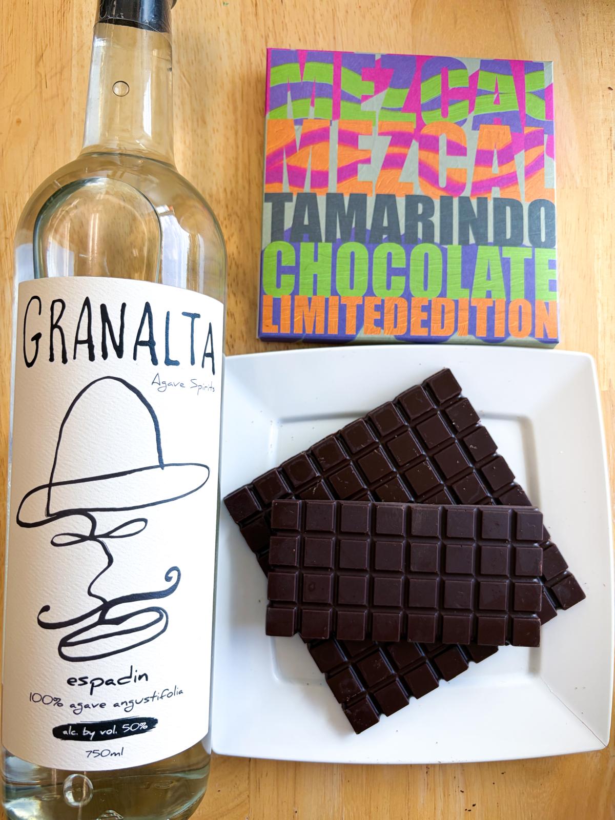 Bottle of Granalta wine with Tamarindo Chocolate on a wooden surface