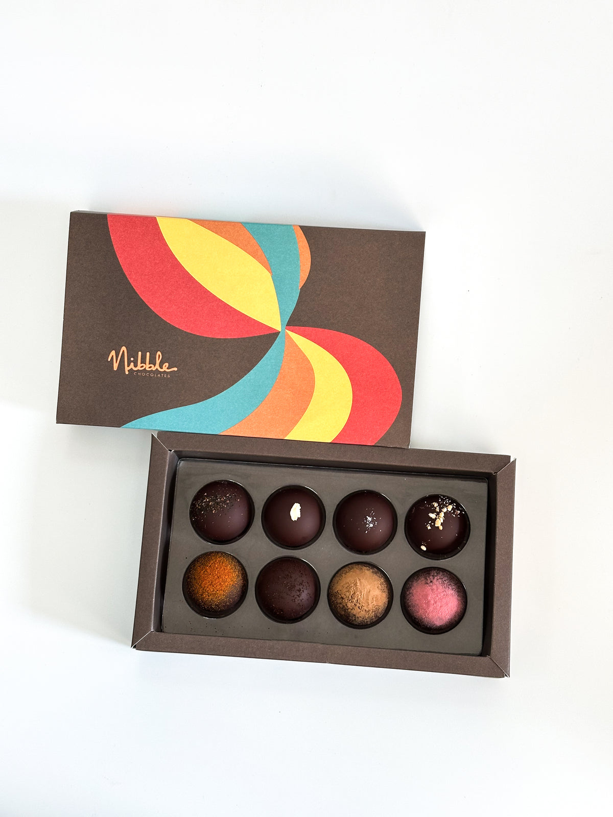Front view of vegan organic chocolate truffle box with colorful packaging – Nibble Chocolate