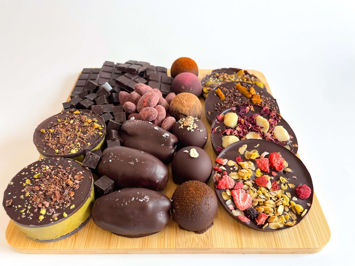 Custom dark chocolate roundies with natural toppings for energy, strength, and balance