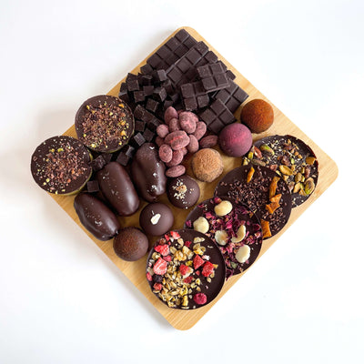 Dark chocolate board with nuts and dried fruit by Nibble Chocolate