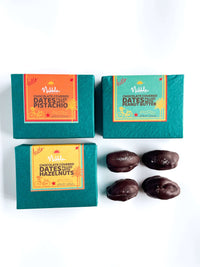 Trio of colorful Nibble Chocolate boxes with chocolate-covered dates displayed