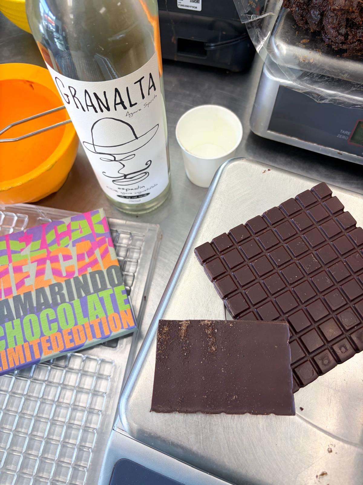 Branalta chocolate bar on a scale with a bottle and packaging in the background