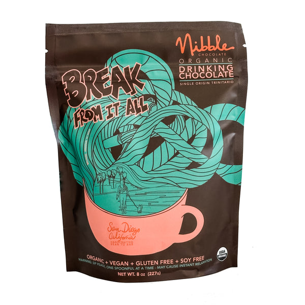 Nibble Organic Drinking Chocolate packaging featuring a whimsical design and a tagline 'Break from It All'.