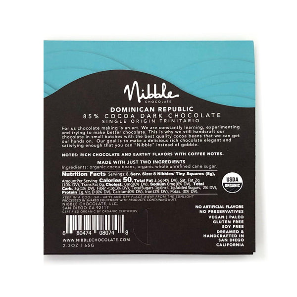 Back packaging of Nibble Extra Dark Chocolate, 85% cocoa from Dominican Republic, featuring nutrition facts and ingredients.