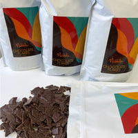Three bags of Nibble Chocolate bulk tempered chocolate with chocolate shavings