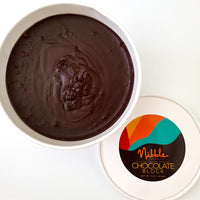 Round tub of tempered chocolate with smooth surface and Nibble Chocolate lid