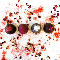 Handcrafted vegan truffles with Valentine's sprinkles on a white background