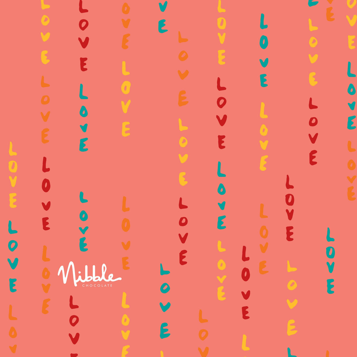 Valentine's Day themed wrapping paper with colorful text for truffle gift box